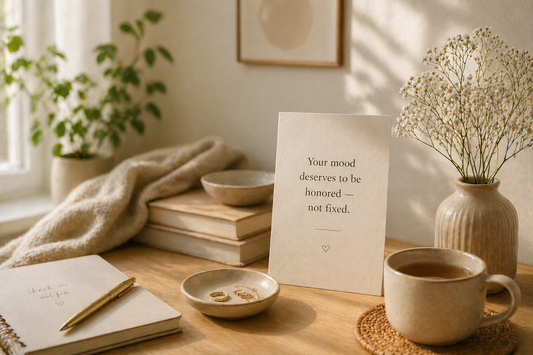 Sunlit scene with journal, tea, and affirmation about honoring your mood